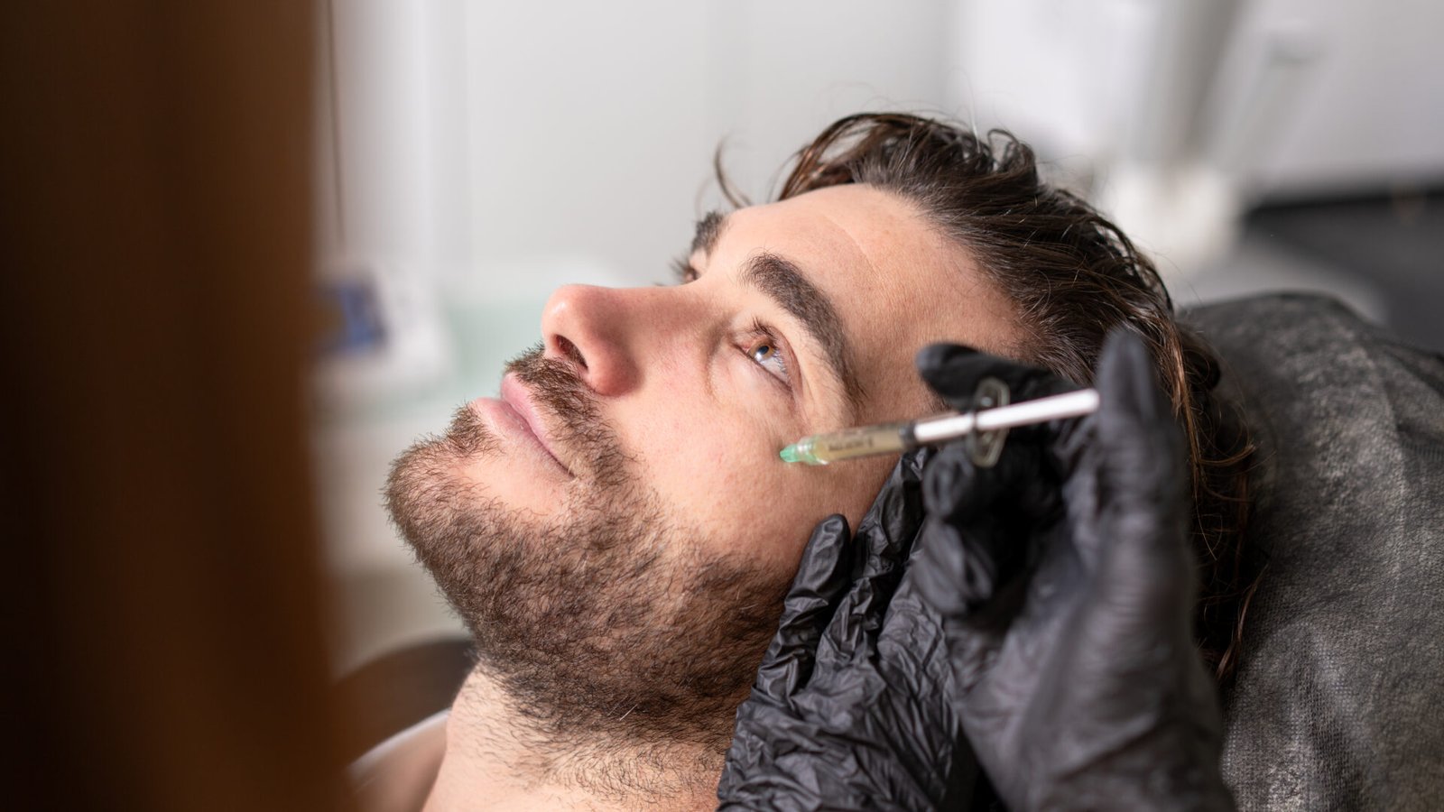Discreet aesthetic treatment for a man for natural improvement and facial refresh