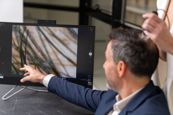 Hair follicle analysis displayed on screen during hair loss diagnosis